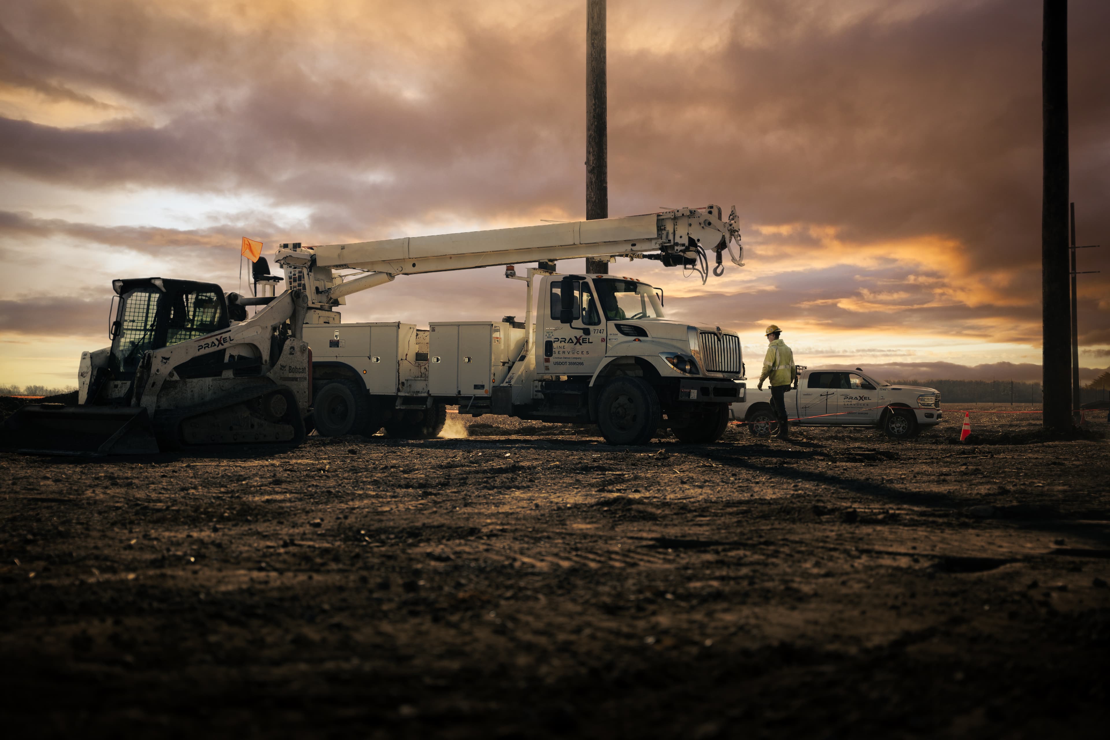 PraXel crews on utility construction project at dusk