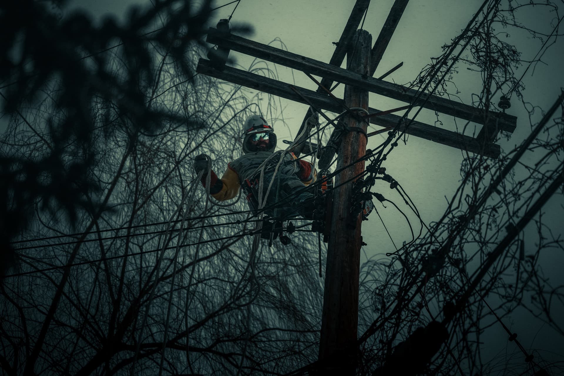Lineman working on transmission line in the field